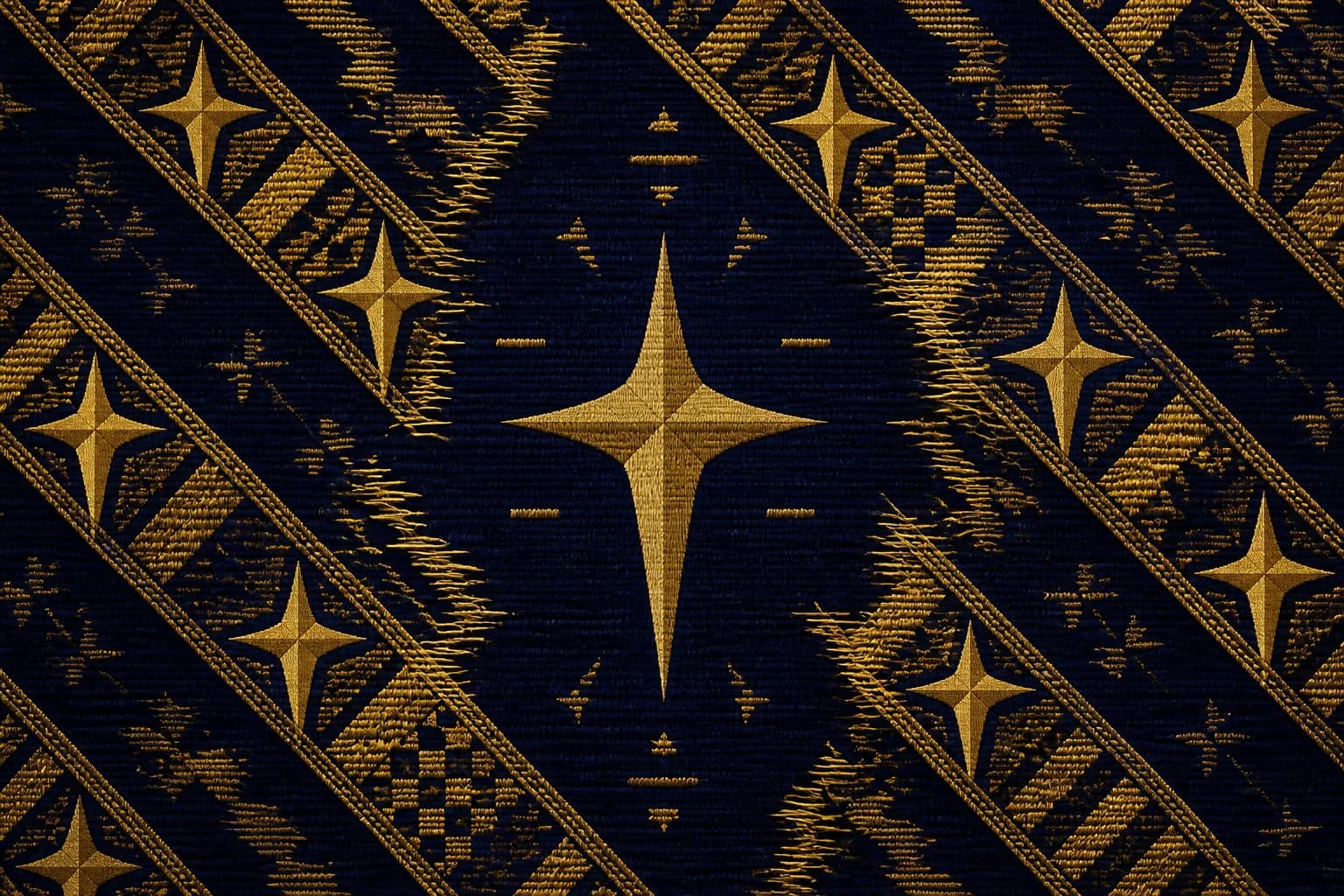 Diagonal gold stripes with visible stitch-and-thread texture crossing a deep navy weave; frayed motifs visibly knit whole along each stripe, with a woven gold cross holding the center.