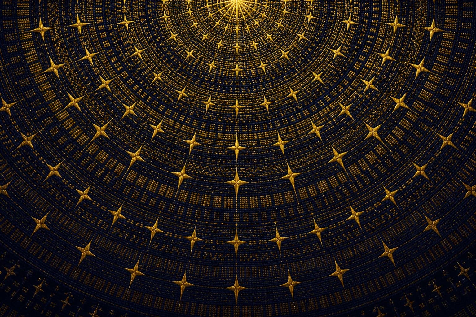 Woven navy-and-gold pattern of concentric rings rippling out from a brilliant gold point at top center like oil landing; the rings carry rows of small gold crosses and kente band motifs that dim toward the dark edges.